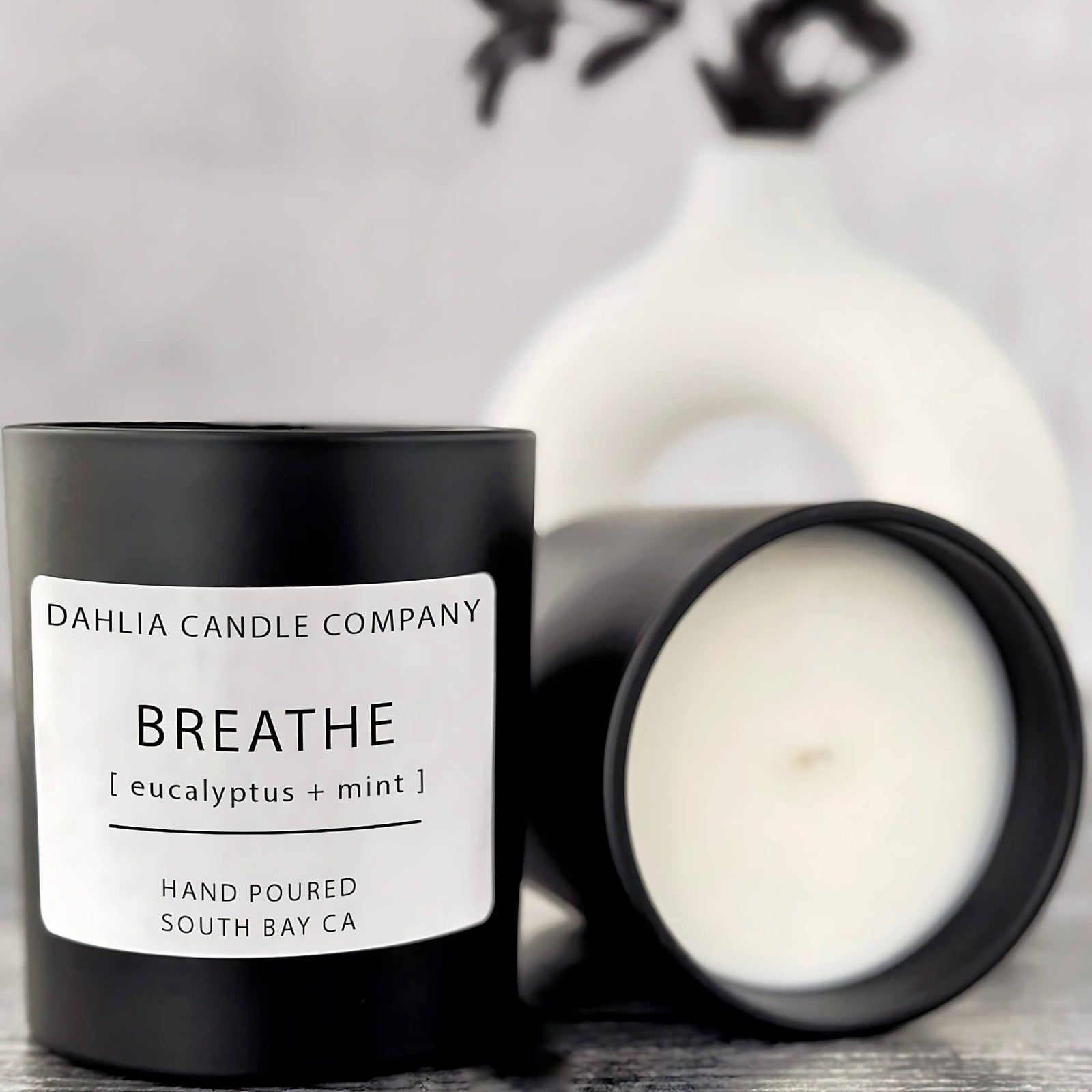Breathe candle with a refreshing blend of eucalyptus and mint, evoking a clean, spa-like aroma.