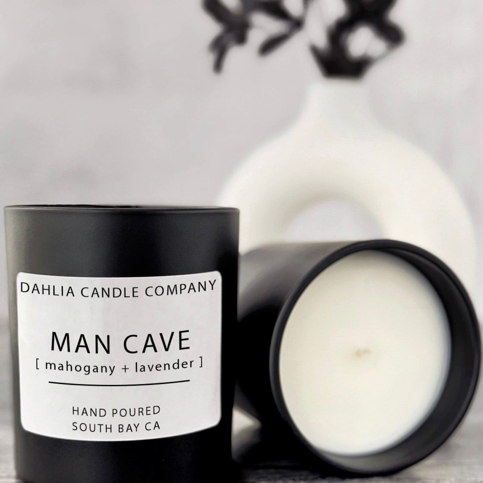 Man Cave candle featuring rich mahogany and soft lavender for a modern, cozy masculine scent.
